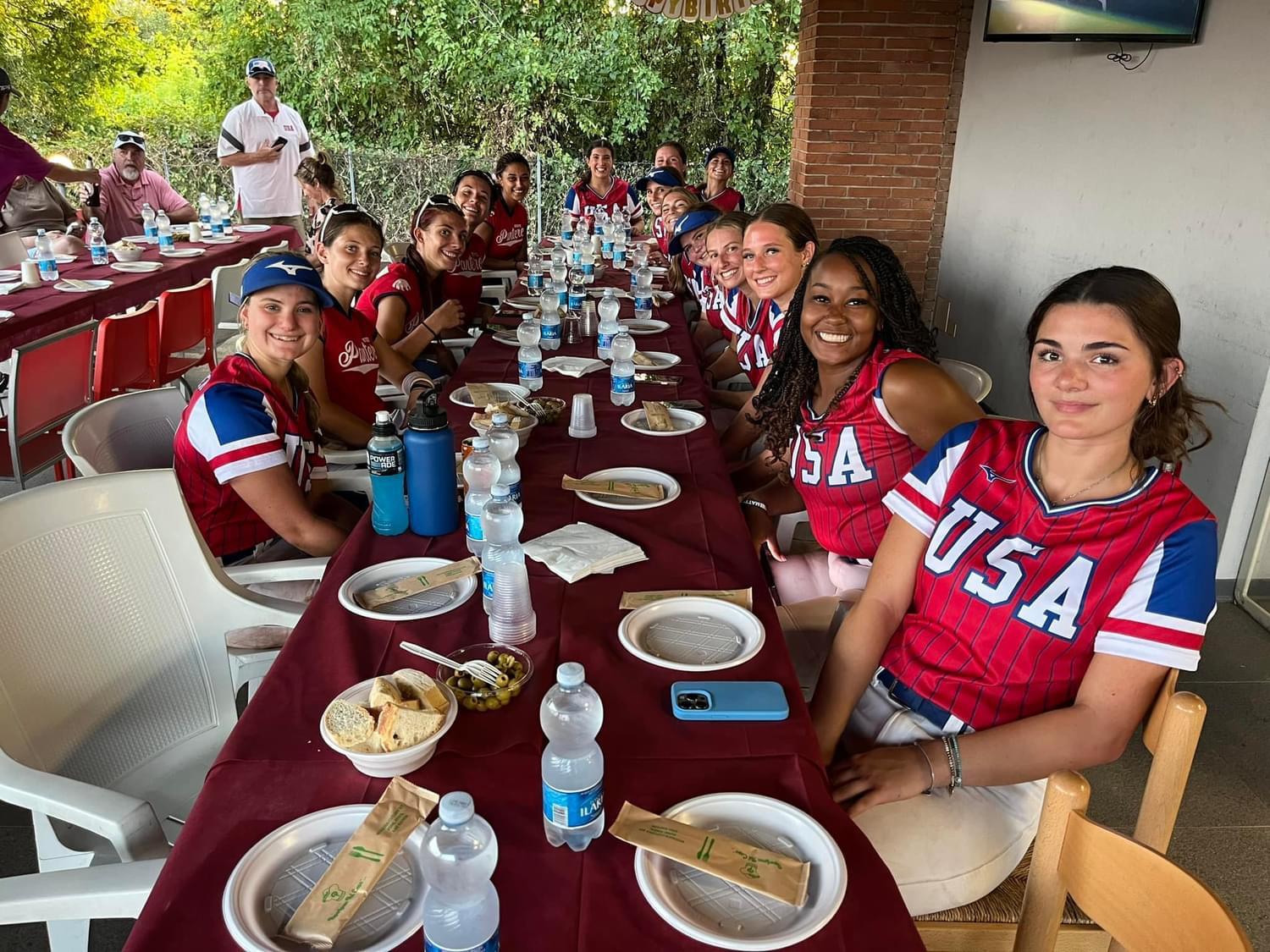 Players walking through a European city